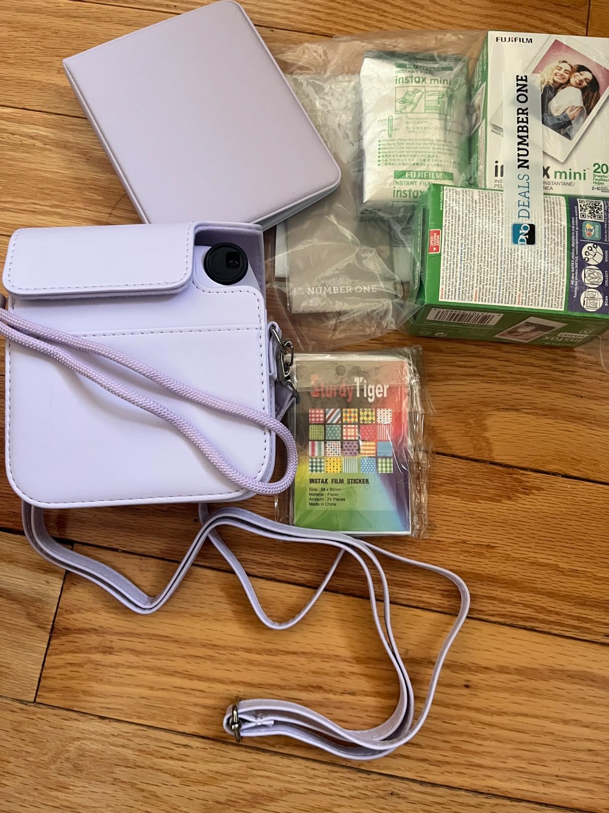 Instax Mini 12 Instant Camera Pastel Blue and Fuji Film Value Pack (60 Sheets) Bundle with Sturdy Tiger Accessories, Carrying Case, Photo Album 64 Pockets customer photo 1