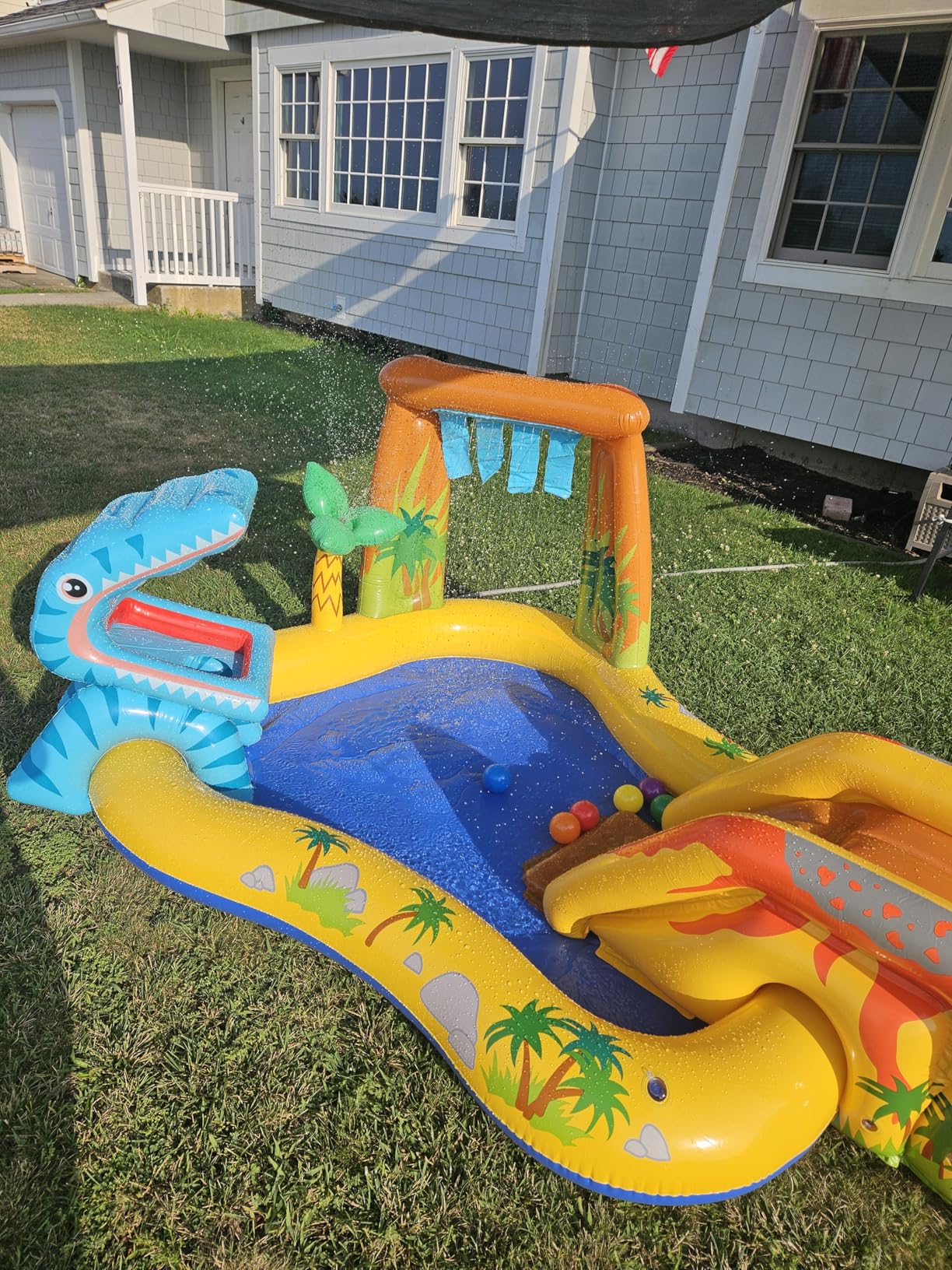 Intex Inflatable Dinosaur Play Center Outdoor Playhouse Inflatable Water Park with Kid Pool Slide, Water Sprayer, Waterfall, and 6 Balls, Multicolor - Customer Photo 2