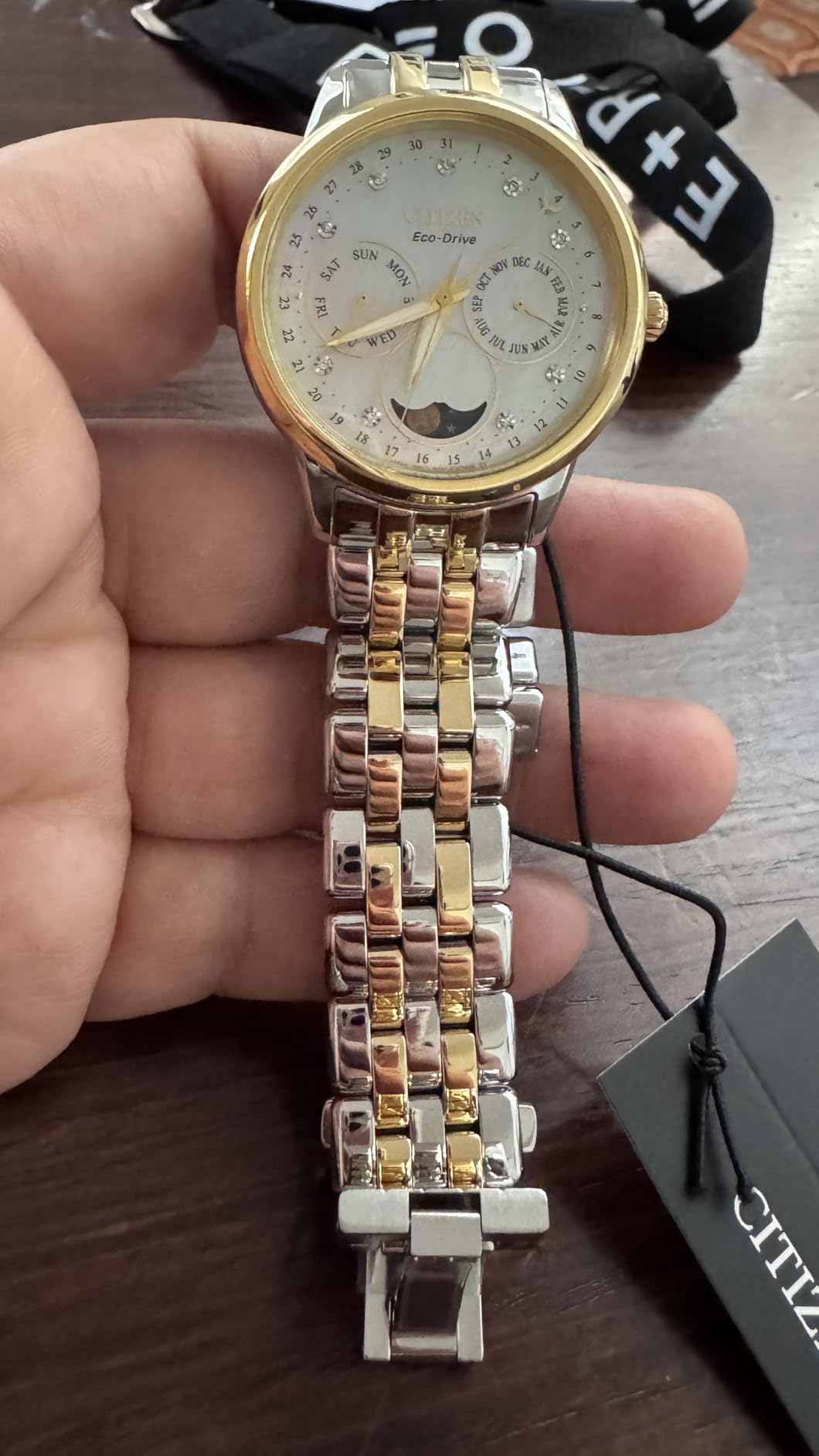 Women's Eco-Drive Calendrier, Moon Phase Diamond Accents Dial, Stainless Case and Bracelet Watch, Month/Day/Date customer photo 1