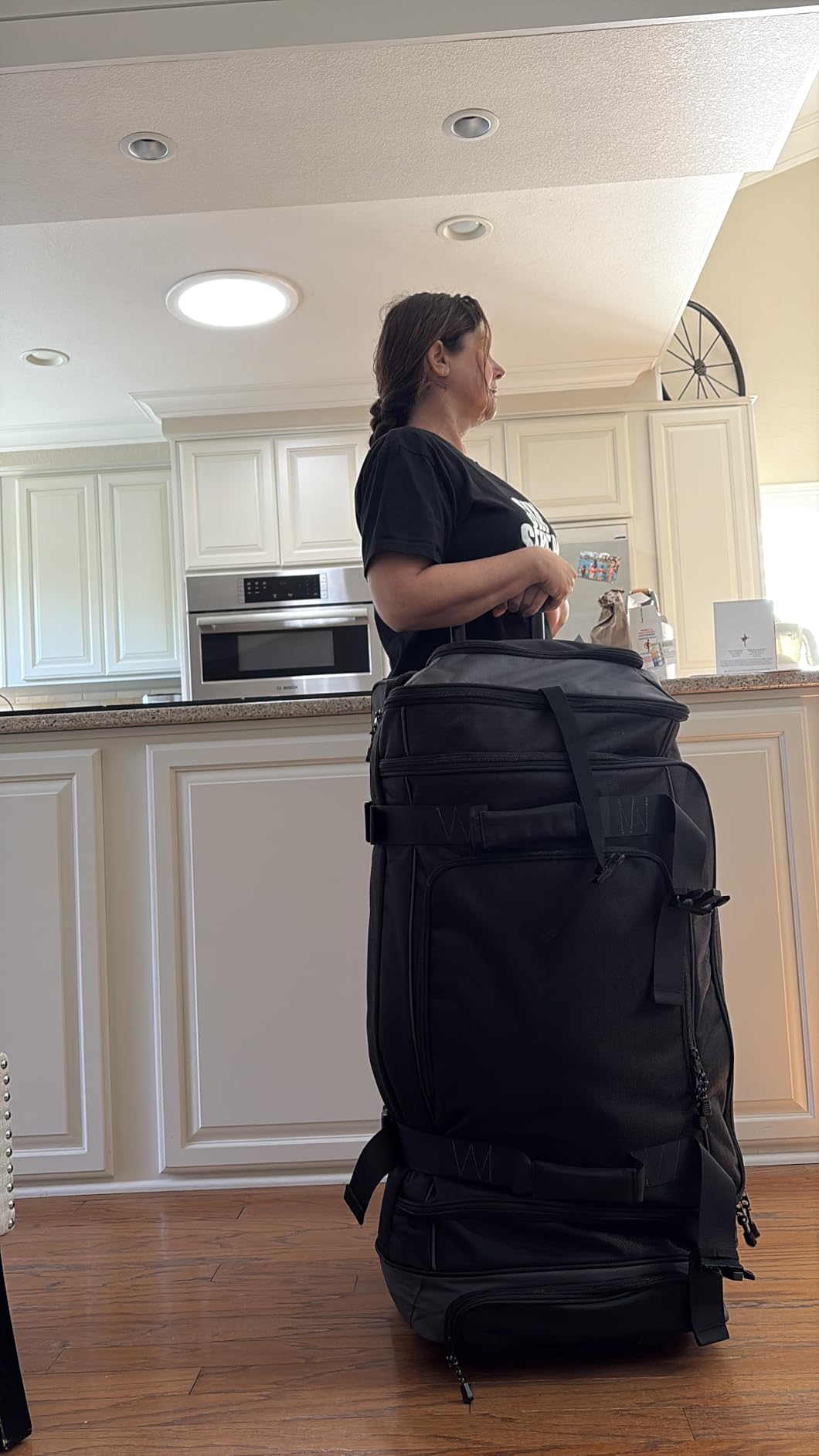Amazon Basics 35-inch Large Rolling Duffel Bag with Wheels and Handle, Travel Duffle with Durable Ripstop Polyester Material, 2 Layers of Storage Space, Multiple Interior and Exterior Pockets, Black customer photo 2