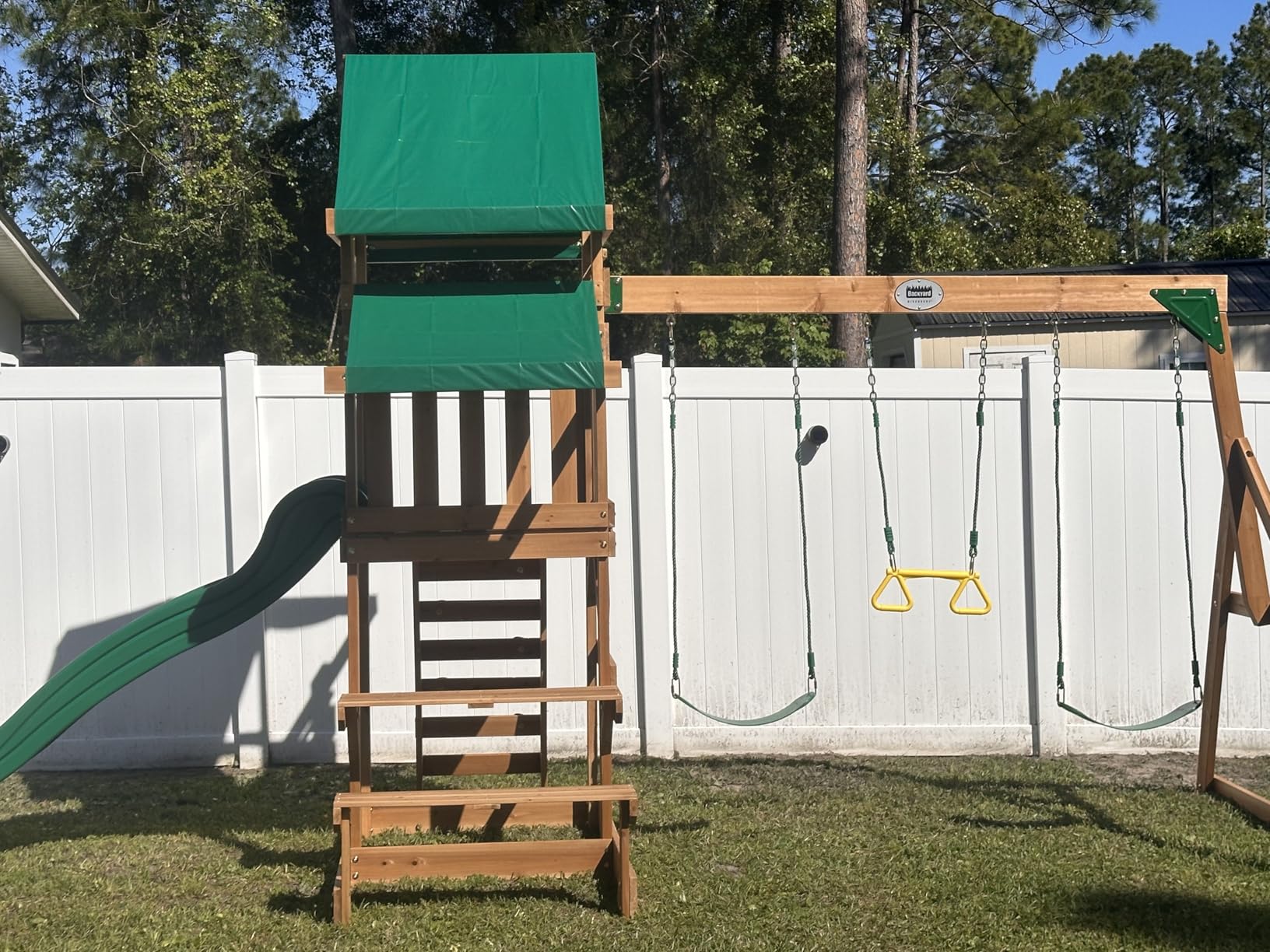 Backyard Discovery Beach Front Cedar Wood Swing Set with Wave Slide, Play Deck, Monkey Bars, Rock Wall Ladder, Shaded Picnic Area, Snack Bar, Belt Swings, Trapeze, Sandbox Area, Outdoor Playset customer photo 1