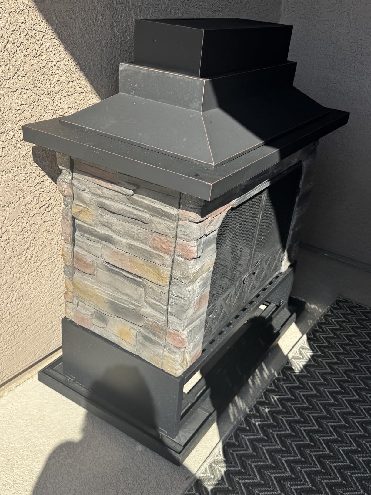 Sunjoy Outdoor Fireplace, Heavy Duty Patio Wood Burning Fireplace with Steel Chimney, Mesh Spark Screen Doors, Removable Grate and Fire Poker, Black customer photo 1