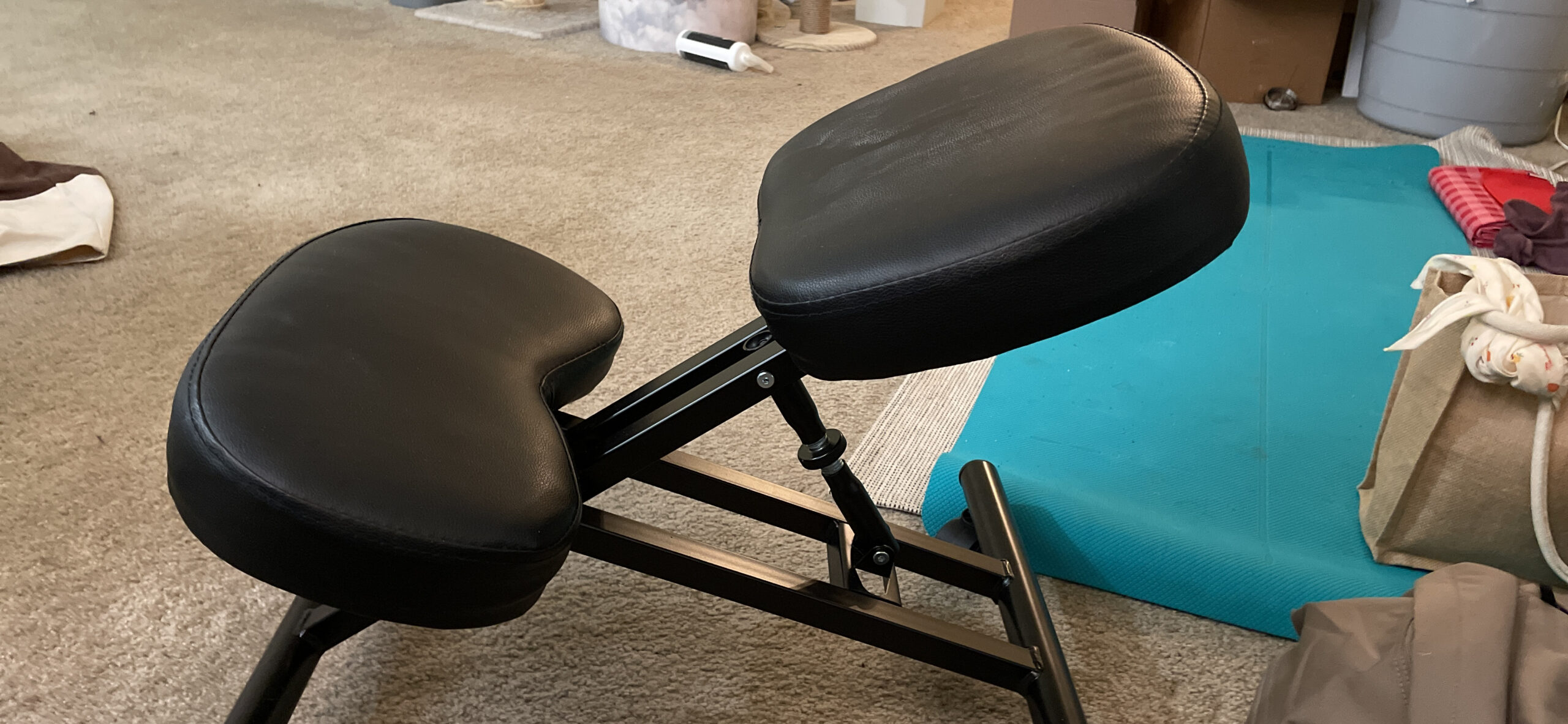 Yaheetech Ergonomic Kneeling Chair, Adjustable Rolling Knee Stool, Black | Thick foam cushions in faux leather support an upright posture; the metal frame tilts 91-130 degrees and rolls on casters. customer photo 1