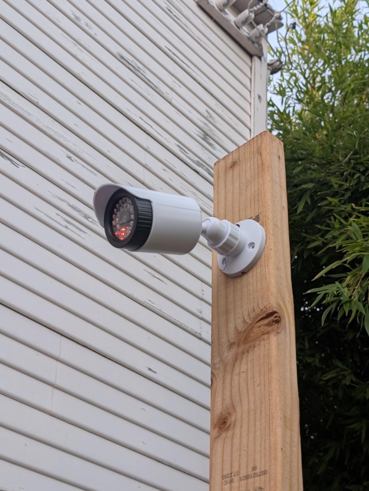 WALI Solar Powered Fake Camera with Motion Sensor Floodlight, 2 Pack, White | Dummy Cameras for Outside, Wireless Simulated Cam, Realistic Look, Larger Solar Panel, Weatherproof, Warning Sticker Included customer photo 1