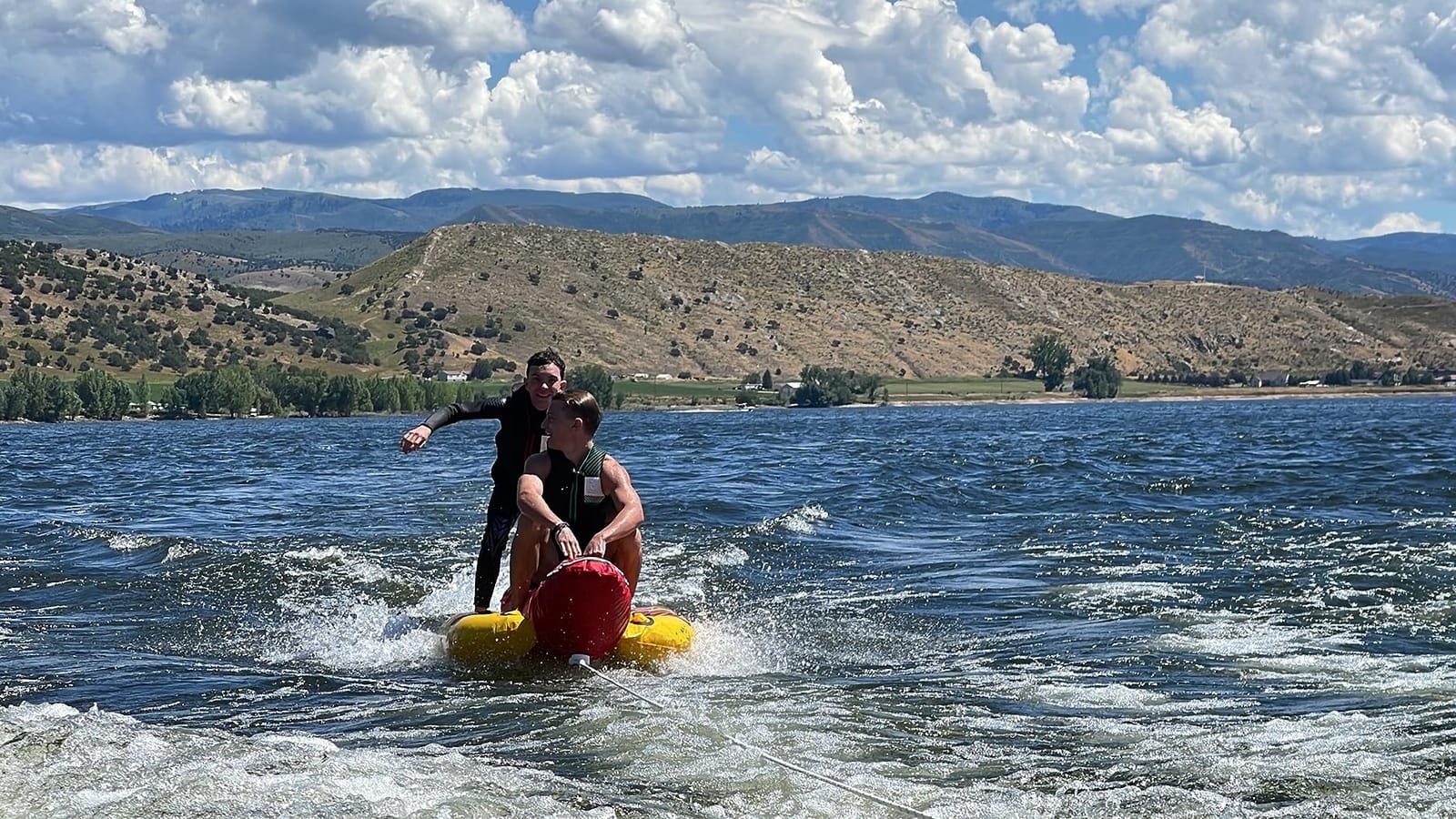 Airhead Hot Dog Towable Tube for Boating, 1-5 Rider Inflatable Boat Tube for Water Tubing, Full Nylon Cover, EVA Padding, Foam Padded Handles w/Neoprene Knuckle Guard, Speed Safety Valve customer photo 2